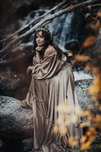 Load image into Gallery viewer, Whimsical girl in the woods wearing a champagne gown and the black pearl headpiece
