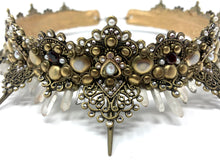 Load image into Gallery viewer, Extreme up close detail photograph that shows the 6mm ruby red garnets accented by the antique gold filigree and surrounded with clear rhinestones and white pearls