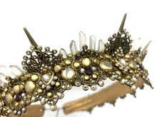 Load image into Gallery viewer, Side view of the details of Amoura, showing off the cascading 5 tiers of quartz crystals in between each 1 inch antique gold spike