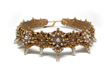 Load image into Gallery viewer, Close up of Caliope crown details with gold filigree and perfectly round white pearls with framed by clear rhinestones
