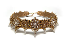 Load image into Gallery viewer, Close up of Caliope crown details with gold filigree and perfectly round white pearls with framed by clear rhinestones