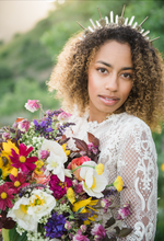 Load image into Gallery viewer, Beautiful mixed bride with big, curly hair wearing the Amunet crown as the 3 inch spikes and large quartz crystal points create a beautiful silhouette on her head