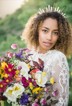 Load image into Gallery viewer, Beautiful mixed bride with big, curly hair wearing the Amunet crown as the 3 inch spikes and large quartz crystal points create a beautiful silhouette on her head
