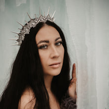 Load image into Gallery viewer, Dark haired beautiful woman with light blue eyes in a glacial ice castle wearing the silver Artemis headpiece
