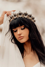 Load image into Gallery viewer, Dark haired beauty with thick black eyelashes in a white dress poses with Arianrhod crown on her head
