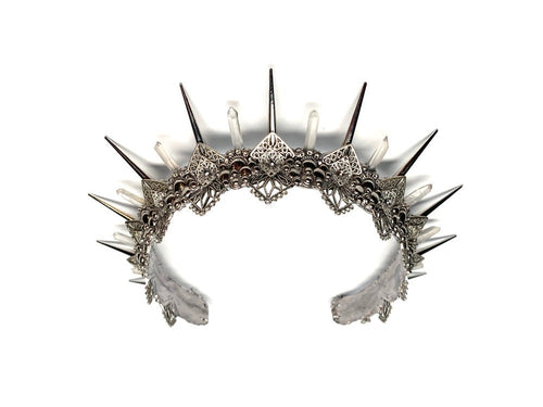Named after the Greek goddess of the Hunt, this silver crown is sure to help you catch your man. 2 inch silver spikes alternate with crystal clear quartz points weaving in between delicate silver filigree that sparkles with rhinestones.