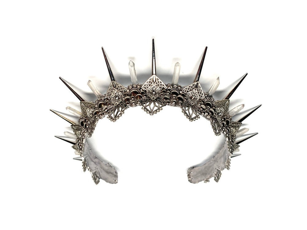 Named after the Greek goddess of the Hunt, this silver crown is sure to help you catch your man. 2 inch silver spikes alternate with crystal clear quartz points weaving in between delicate silver filigree that sparkles with rhinestones.