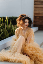 Load image into Gallery viewer, Woman posing in orange ruffled dress at golden hour as the sunlight reflects off her dark curls and the antique gold crown with crystals reflects the light
